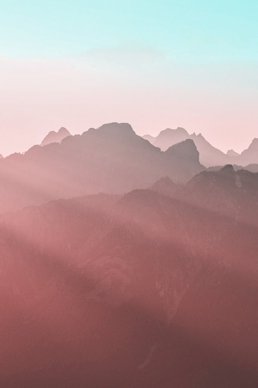 photo of mountains during dawn